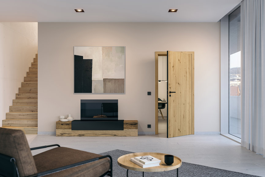 Drzwi drewniane z powierzchnią Duradecor w naturalnej drewnianej okleinie i z kontrastowymi krawędziami 4Protect w kolorze czarnym oraz okuciami black.edition nadają skrzydłu bardzo ciekawy wygląd.